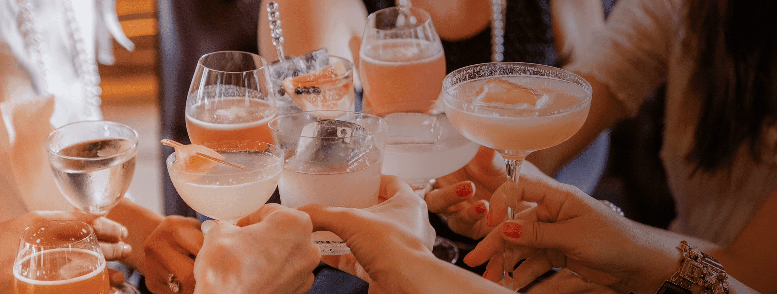 People toasting with wine glasses